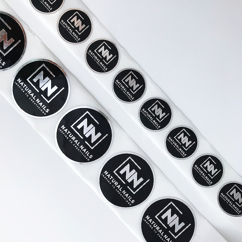 Adhesive stickers for cosmetic packaging